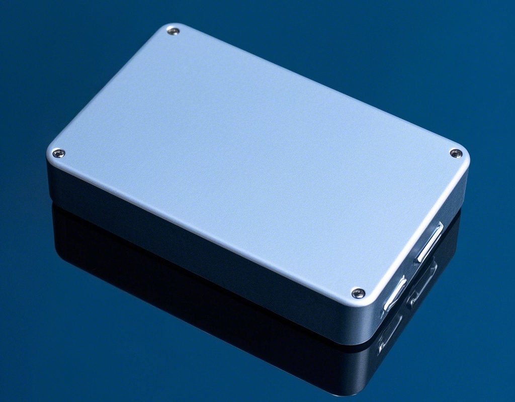 Customizable rectangular aluminum box on reflective blue surface