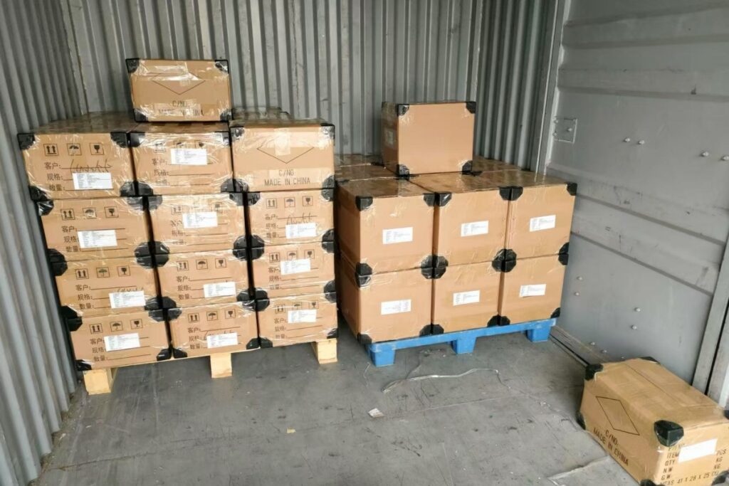 Packed and stacked cardboard boxes on pallets for export shipment.