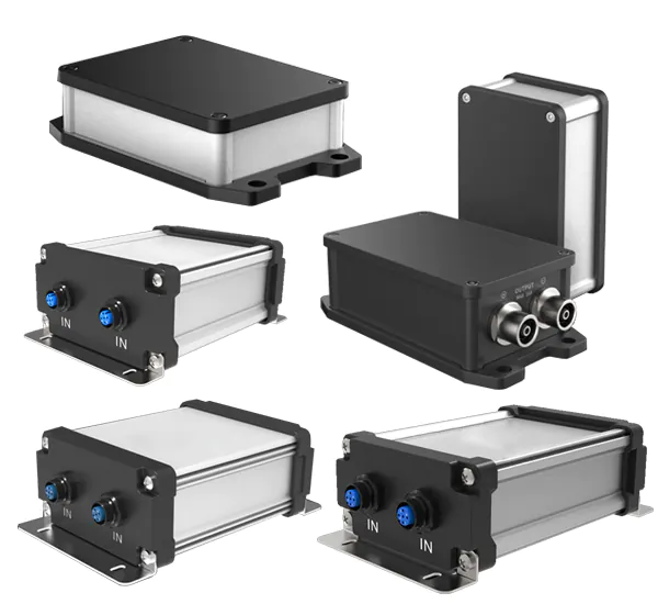 A collection of robust, industrial-grade IP68 aluminum enclosures is presented on a clean white background. Each enclosure features a silver-colored, extruded aluminum body, often with subtle grooves, indicating a design focused on durability and heat dissipation. These bodies are paired with contrasting black end caps or covers, securely fastened with visible screws, emphasizing the rugged construction.